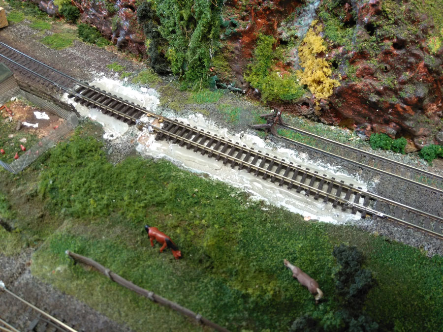 Then a trackbed surface was added (the grey mass), and the track was relaid on top of that.