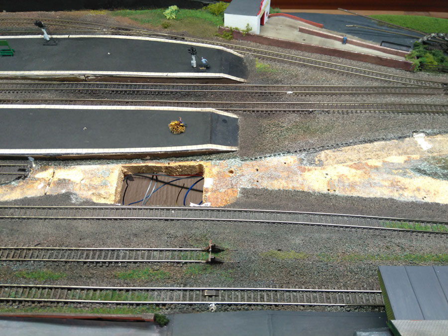 The track was pulled up, along with the feeder lines, and there it is - gone! Note the massive hole in the board for the original point motors.