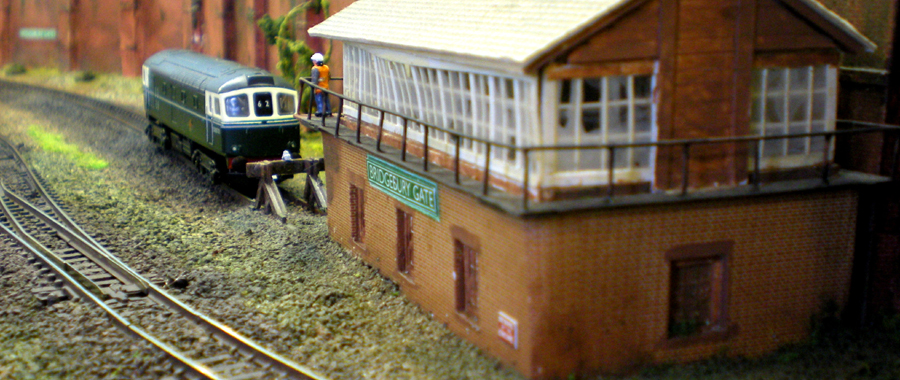 With a trial hi-viz jacket on display (for this time period), the driver of the Class 33 has a last look before raiding the signal box for tea and cakes...