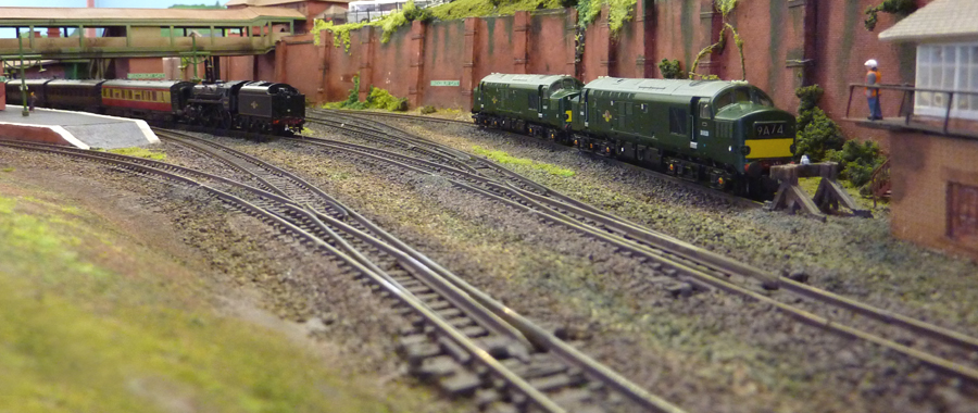 A trackside shot of the steam rail tour pausing at Bridgebury Gate, although that loco is probably breaking one or two modern rail regulations by running tender first.
