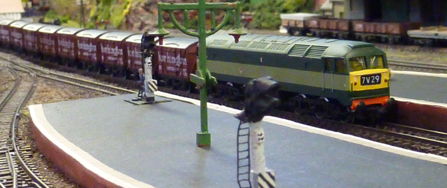 A British Rail green Class 47 (pre-TOPS, using a resprayed Poole-era Graham Farish loco) takes the Wothington beer train east - all forty wagons of it.