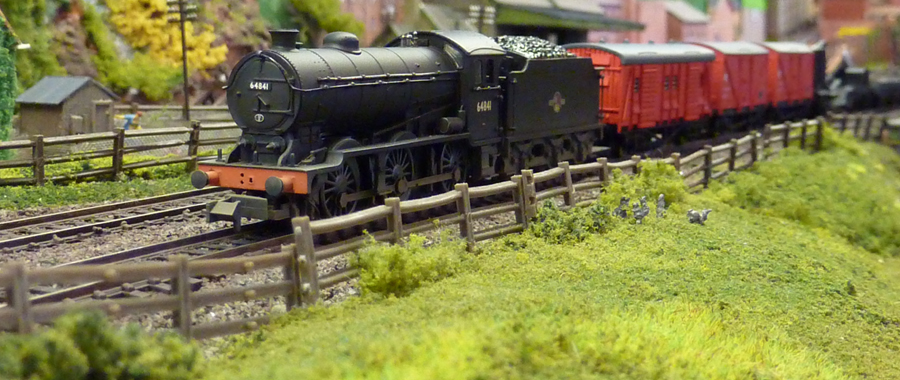 Unusually, a J39, No 64841 looking rather nice, takes the track repair train west...